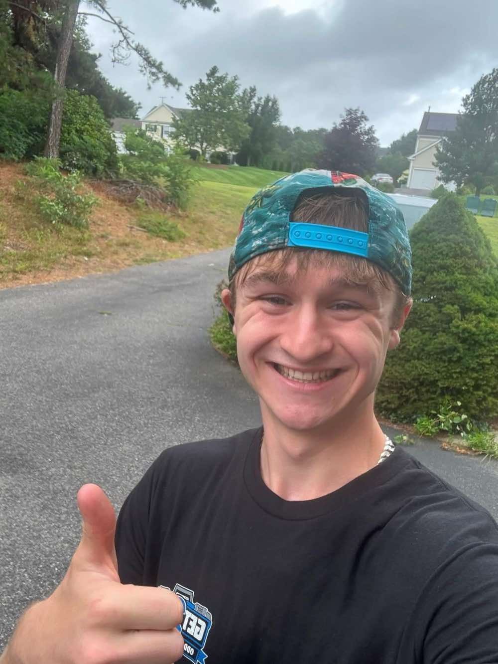 Aiden Hennessey, founder of Get2It, giving a thumbs up after a job well done